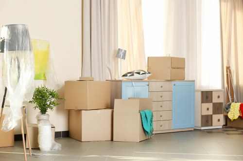 Removal van and moving boxes outside a Croydon home