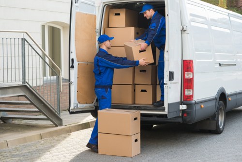 Removal truck and movers during a house relocation in Croydon