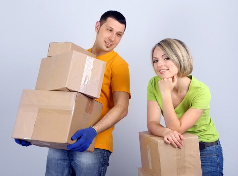Loading furniture and boxes into a moving van in Croydon